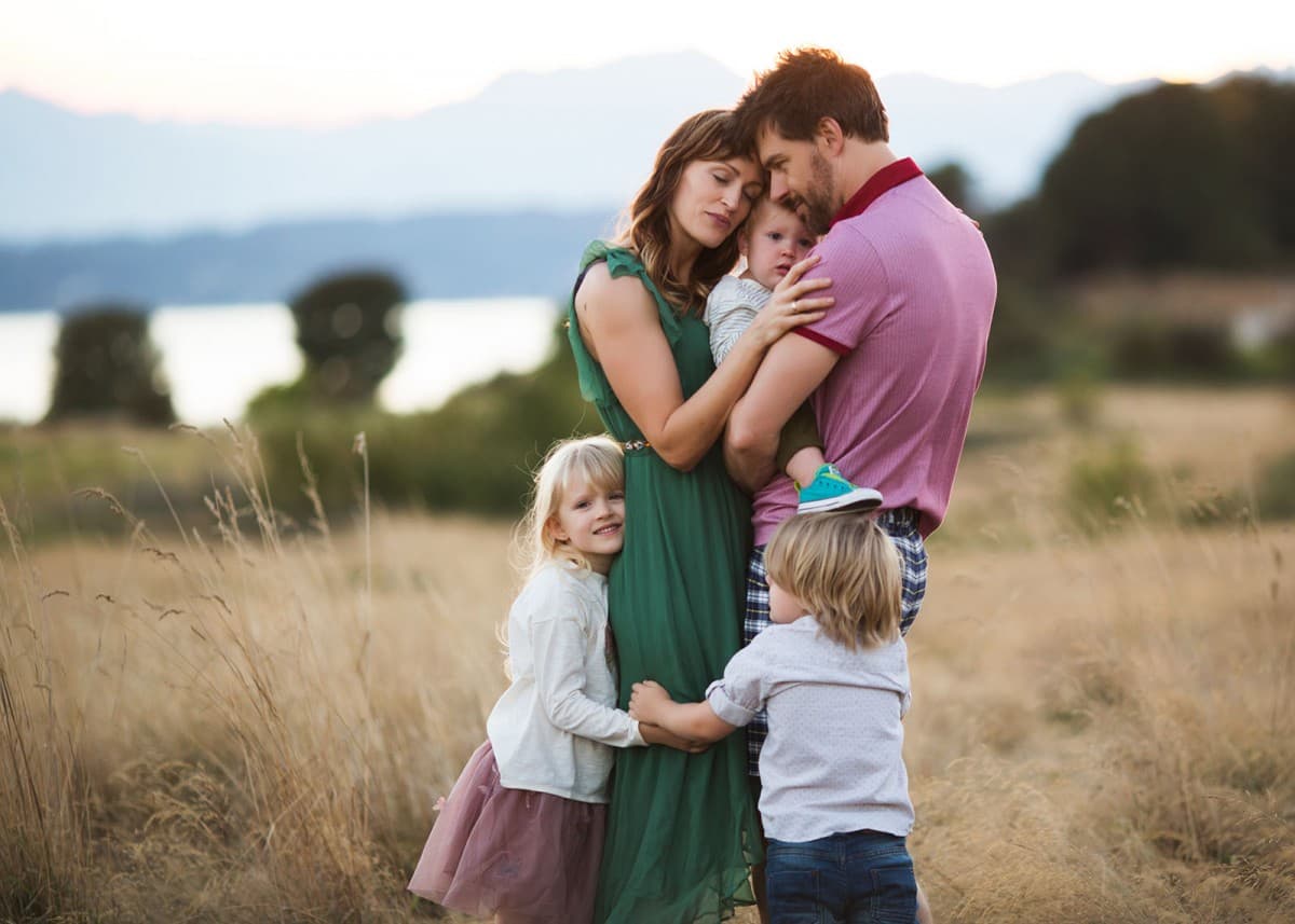 Family smiling together outdoors